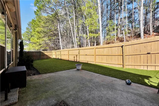 a view of a swimming pool with a yard