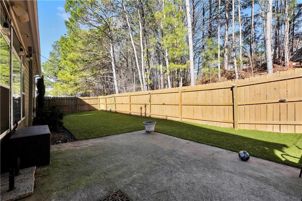 340 Roland Manor Drive Dacula, GA 30019 - Photo 44 of 50 a view of backyard with green space