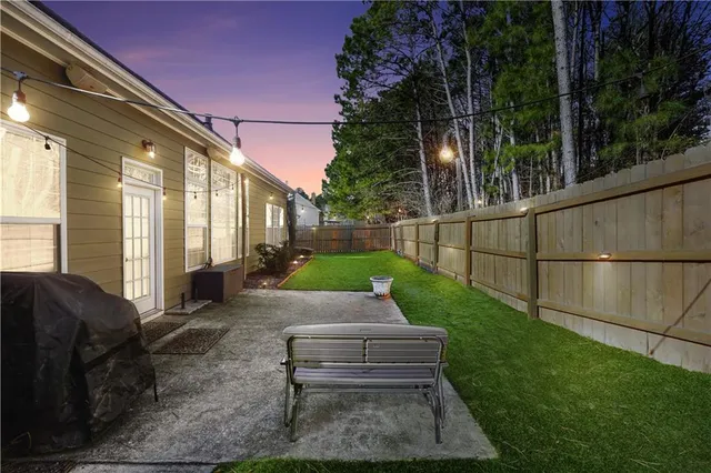 a front view of a house with outdoor seating and plants