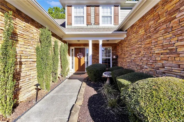 an aerial view of a house with outdoor space