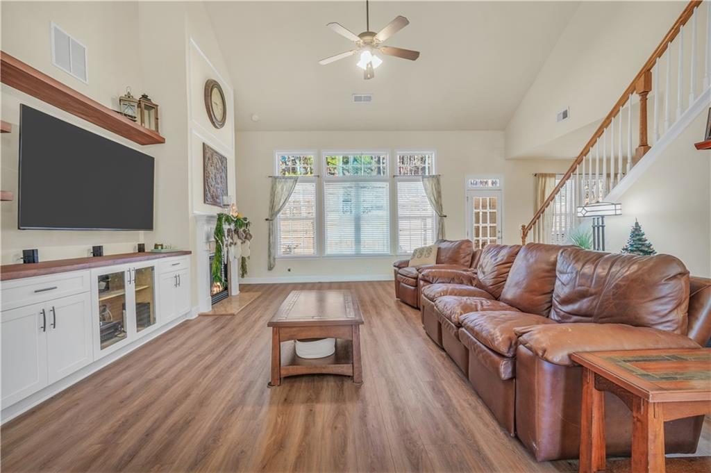 340 Roland Manor Drive Dacula, GA 30019 - Photo 5 of 50 a living room with furniture and a flat screen tv