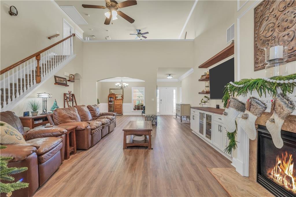 340 Roland Manor Drive Dacula, GA 30019 - Photo 6 of 50 a living room with furniture and a flat screen tv