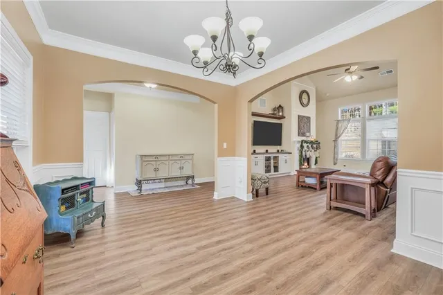 a living room with furniture dining table and a fireplace