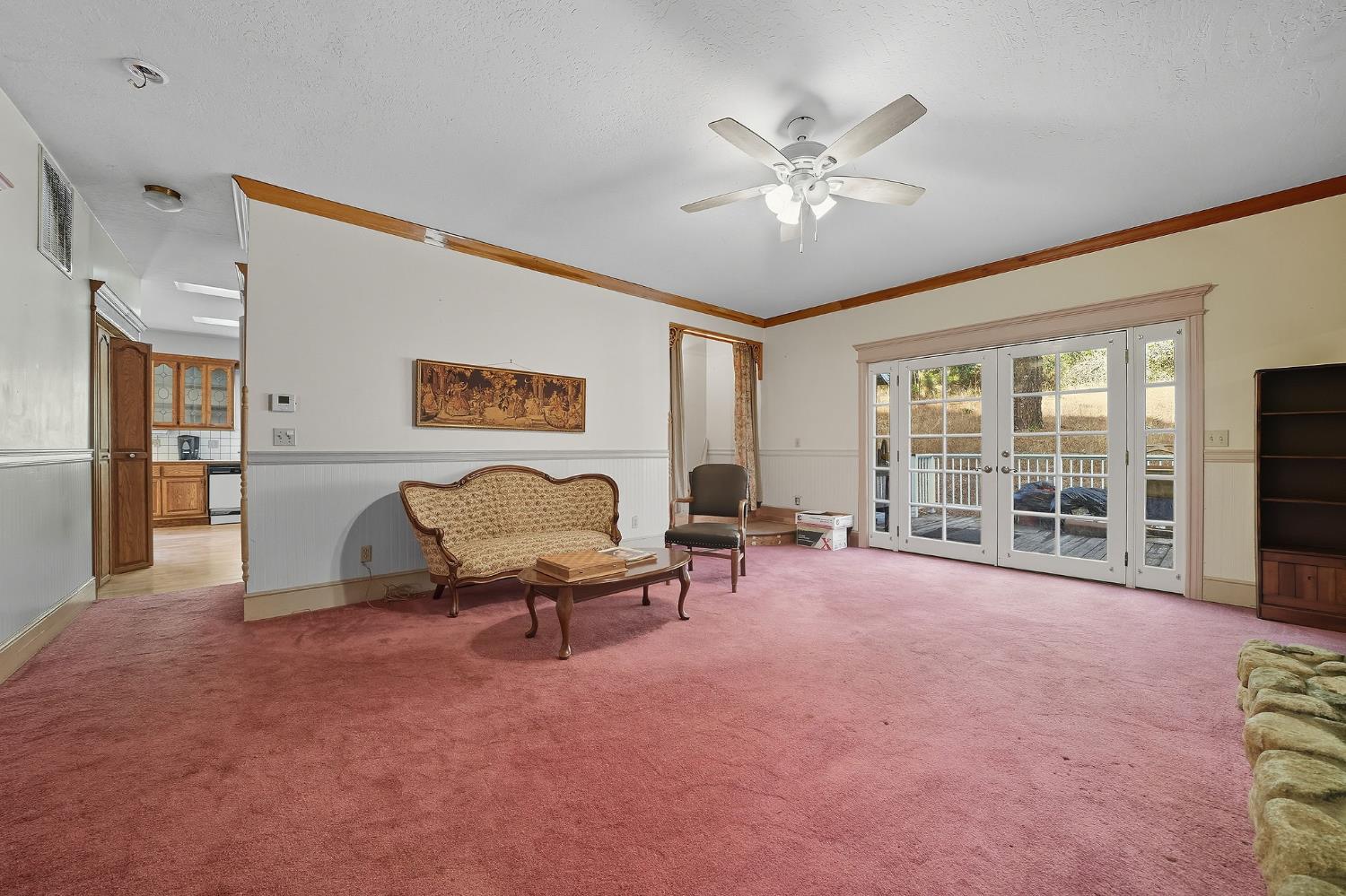 12810 New York Ranch Road Jackson, CA 95642 - Photo 25 of 56 a view of a livingroom with furniture and a ceiling fan