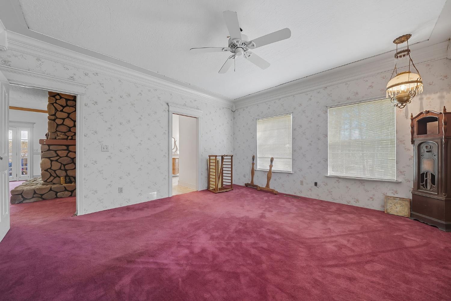 12810 New York Ranch Road Jackson, CA 95642 - Photo 29 of 56 an empty room with windows and fan