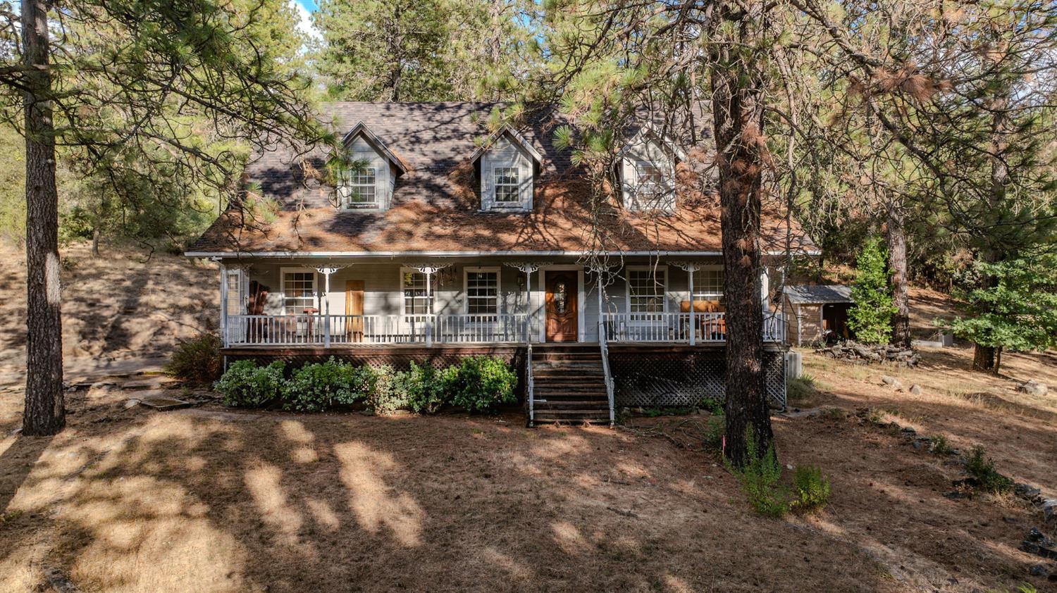 12810 New York Ranch Road Jackson, CA 95642 - Photo 3 of 56 a front view of a house with a garden