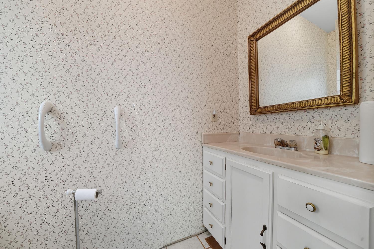 12810 New York Ranch Road Jackson, CA 95642 - Photo 45 of 56 a bathroom with a double vanity sink and mirror