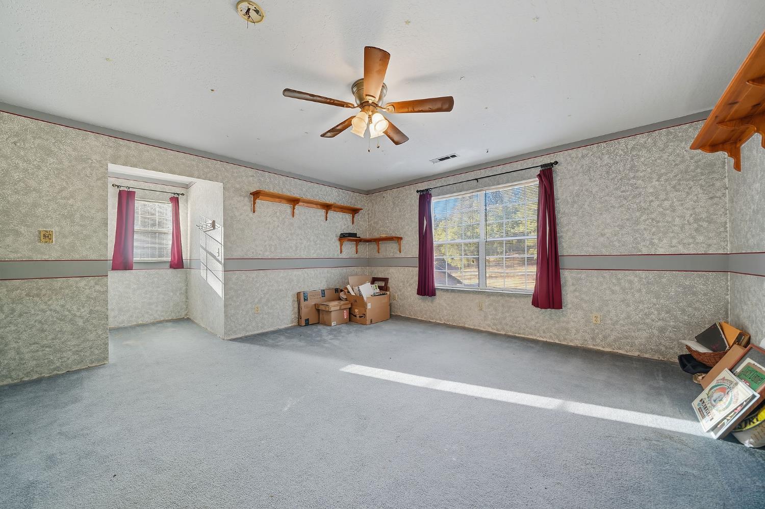 12810 New York Ranch Road Jackson, CA 95642 - Photo 47 of 56 a view of a livingroom with a ceiling fan and window