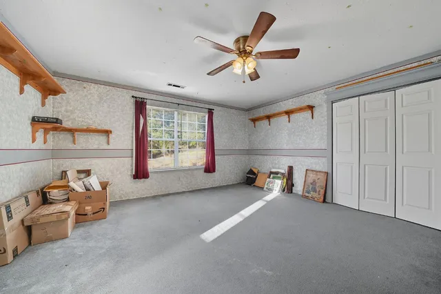 a work room with furniture and wooden floor