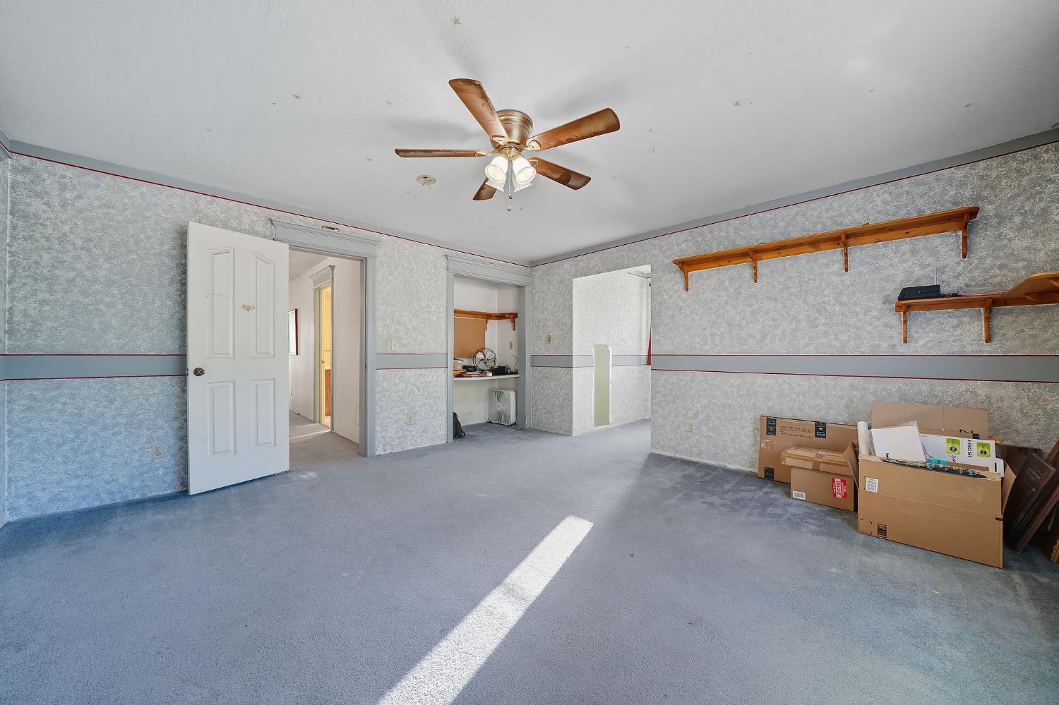 12810 New York Ranch Road Jackson, CA 95642 - Photo 49 of 56 a view of empty room with cabinet and ceiling fan