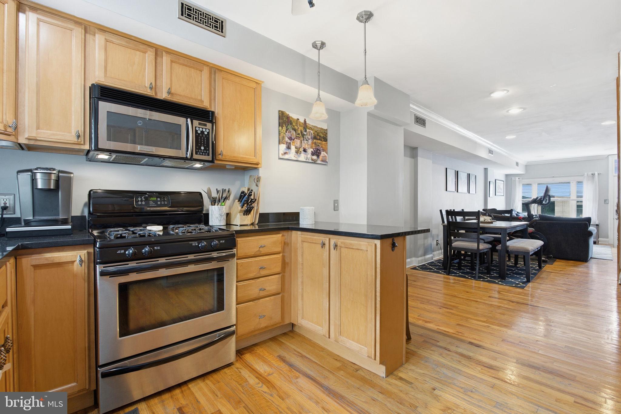 735 South Curley Street Baltimore, MD 21224 - Photo 6 of 16 Kitchen Open to Dining & Living