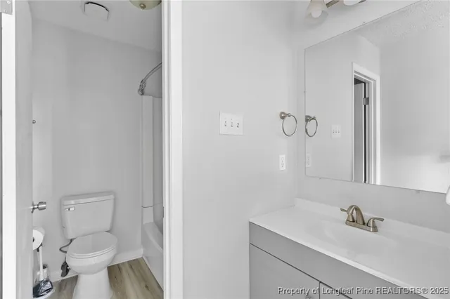 a bathroom with a sink toilet and tub