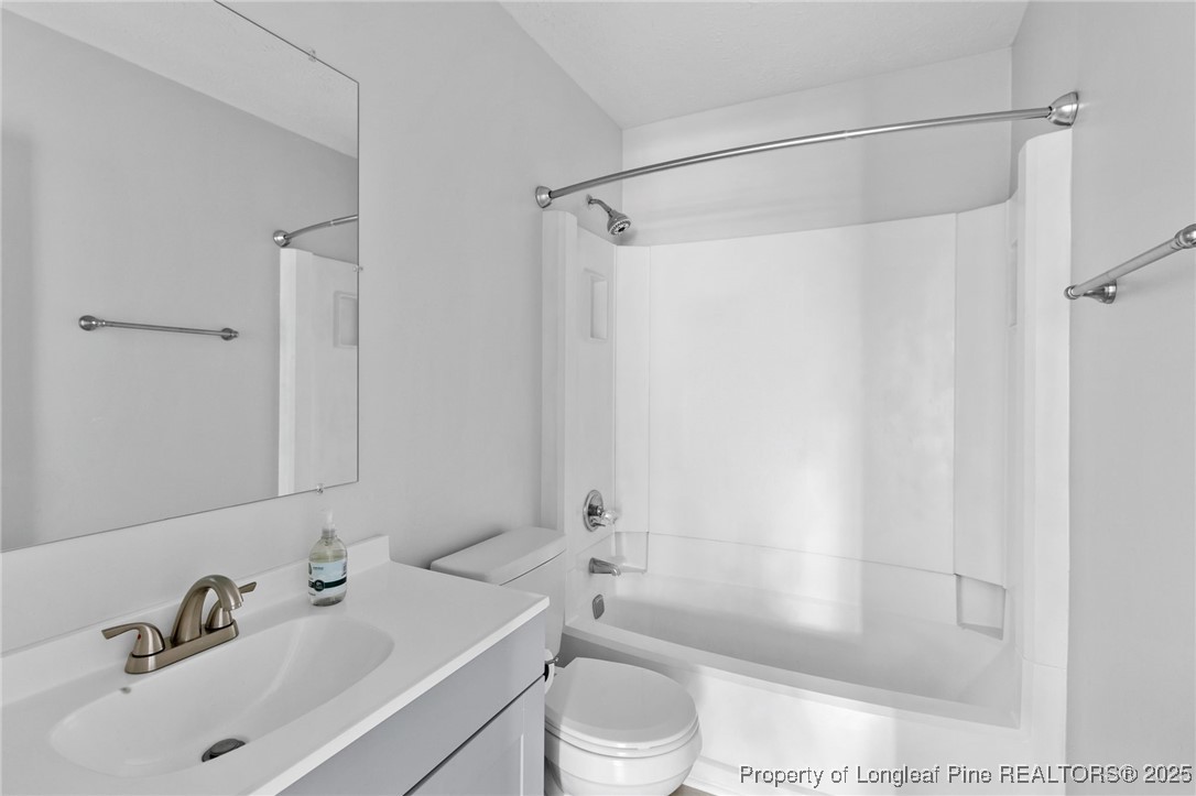 6838 Timbercroft Lane Fayetteville, NC 28314 - Photo 13 of 17 a bathroom with a sink toilet and shower