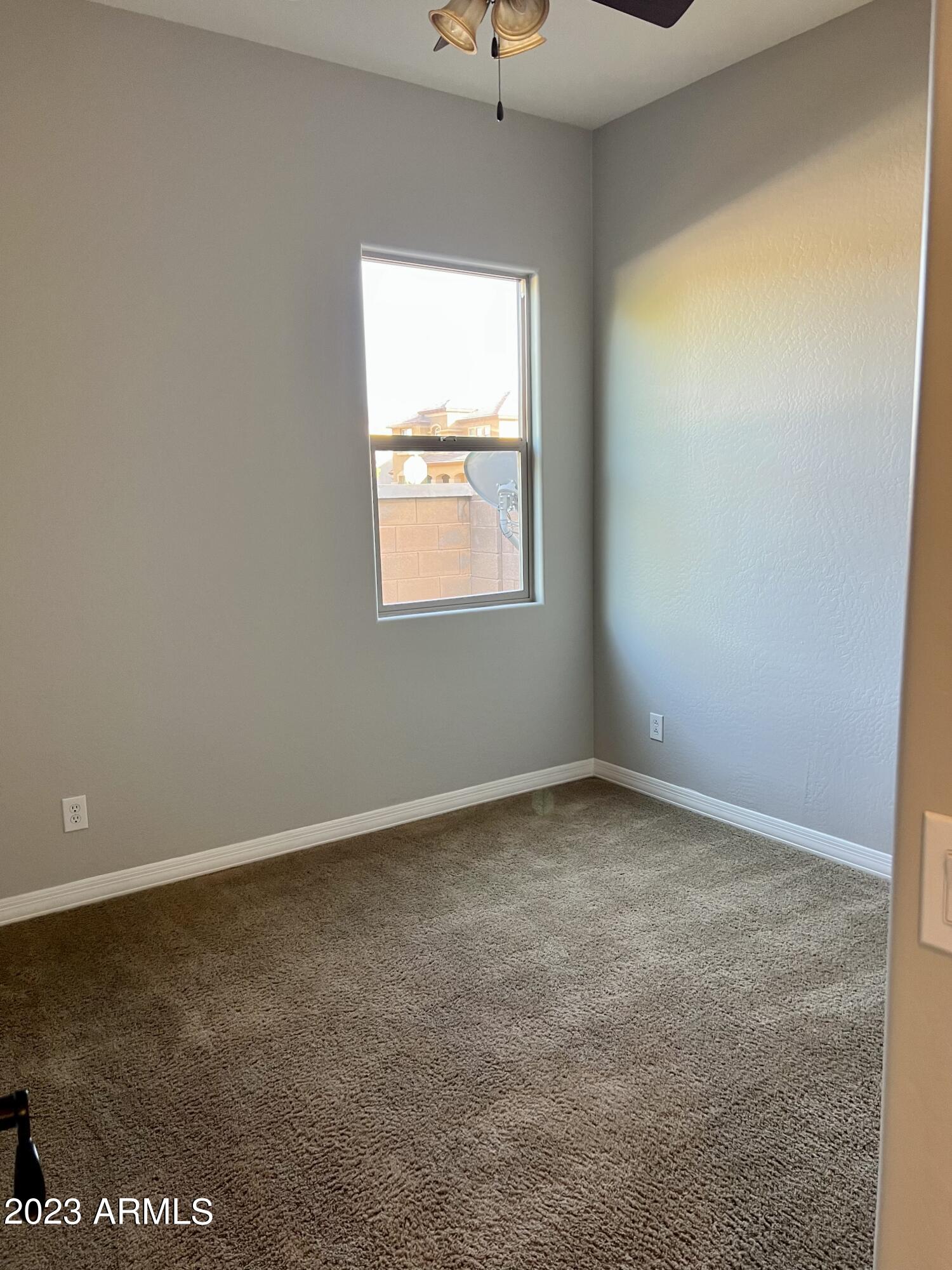 20296 East Sonoqui Boulevard Queen Creek, AZ 85142 - Photo 11 of 22 an empty room with a window