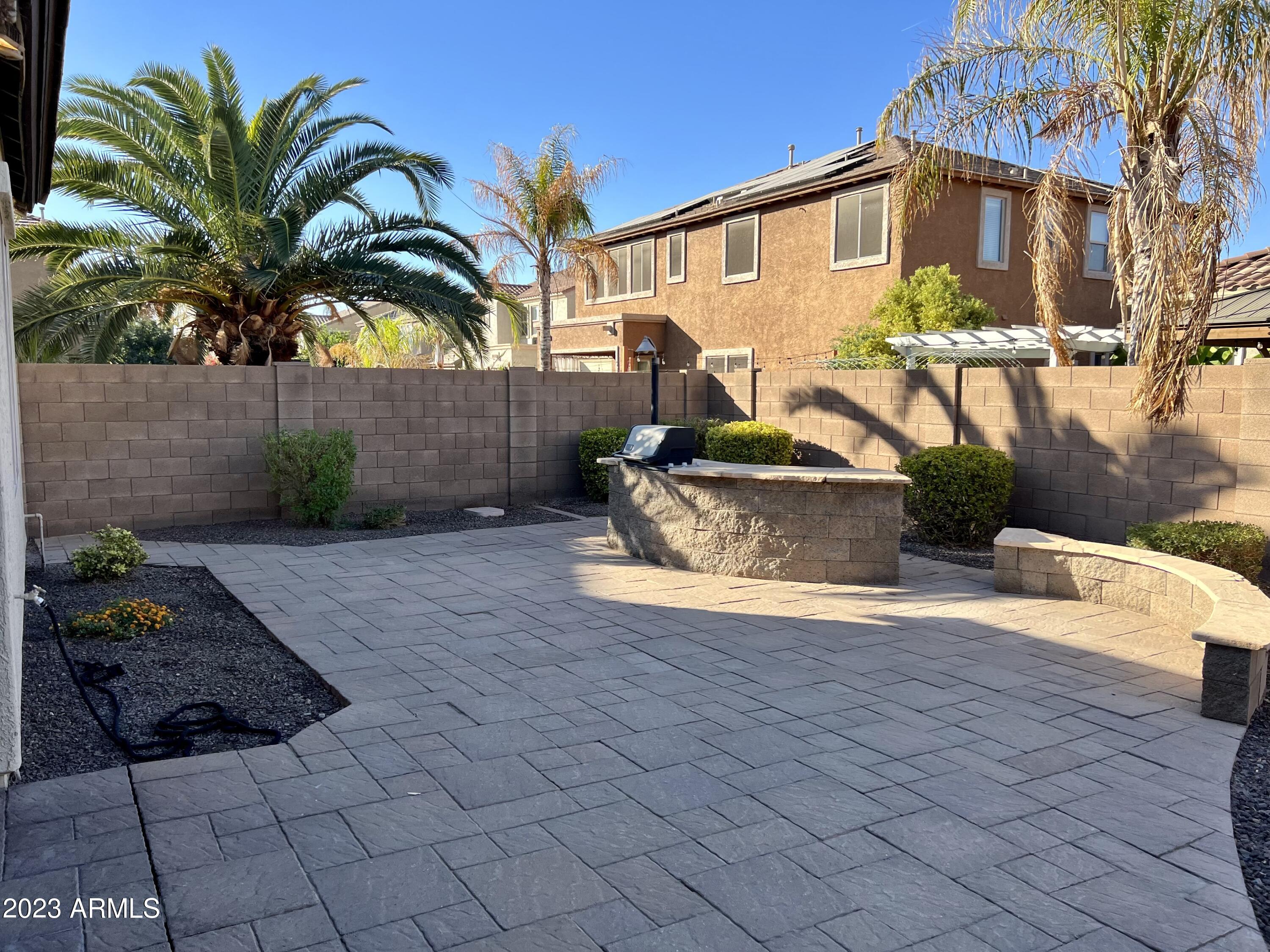 20296 East Sonoqui Boulevard Queen Creek, AZ 85142 - Photo 14 of 22 a view of a house with backyard and sitting area
