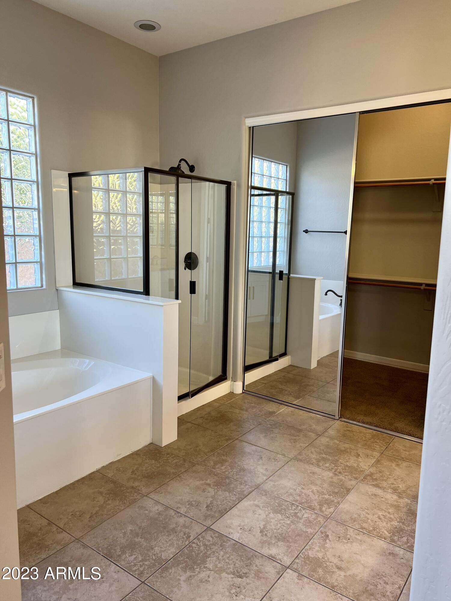 20296 East Sonoqui Boulevard Queen Creek, AZ 85142 - Photo 15 of 22 a view of an empty room with window and a bathroom