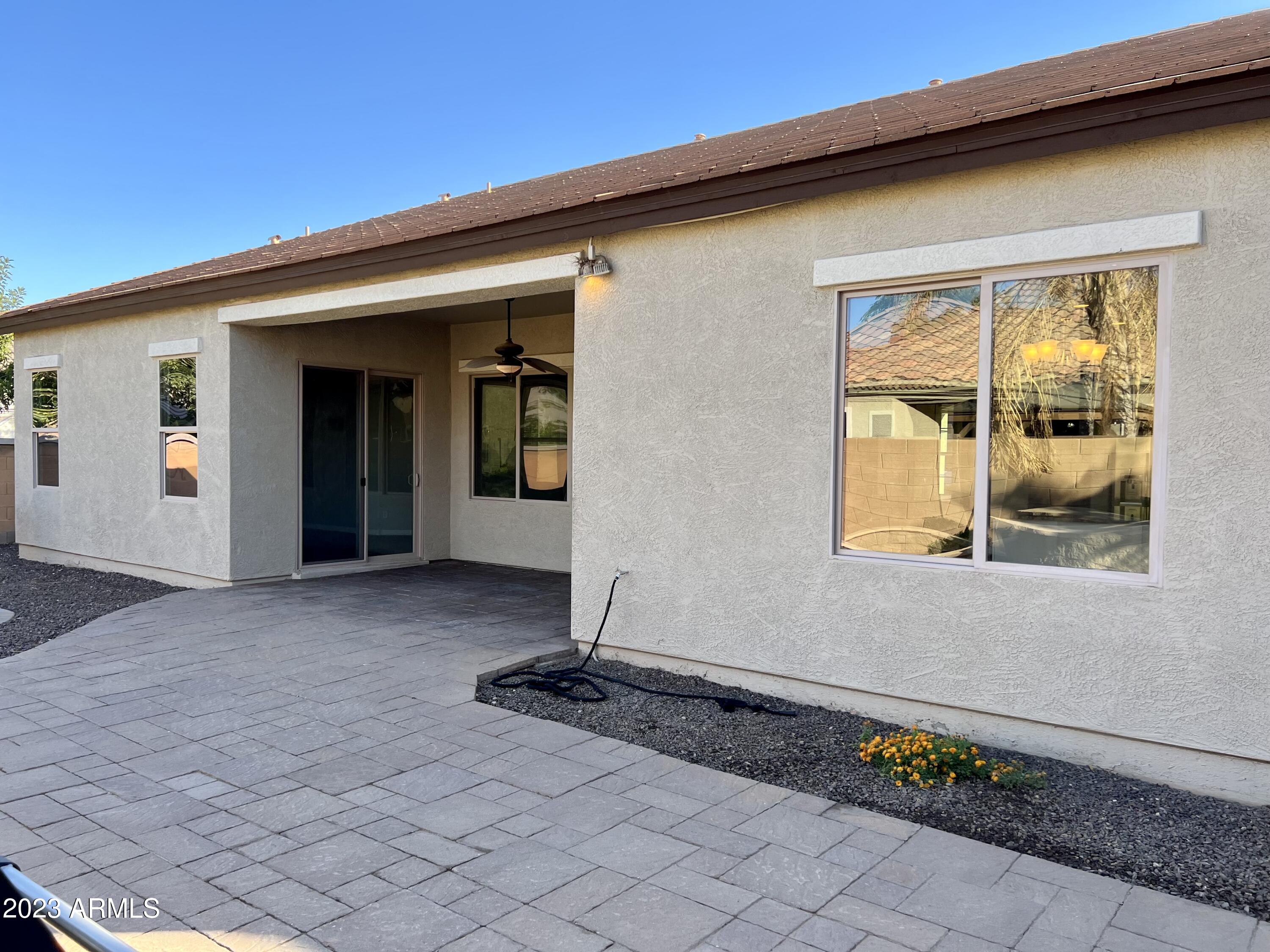 20296 East Sonoqui Boulevard Queen Creek, AZ 85142 - Photo 19 of 22 a front view of a house with a yard