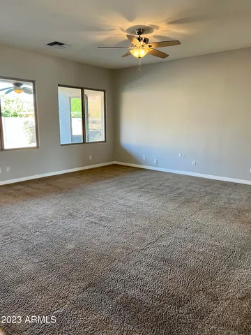 a view of a house with backyard and swimming pool