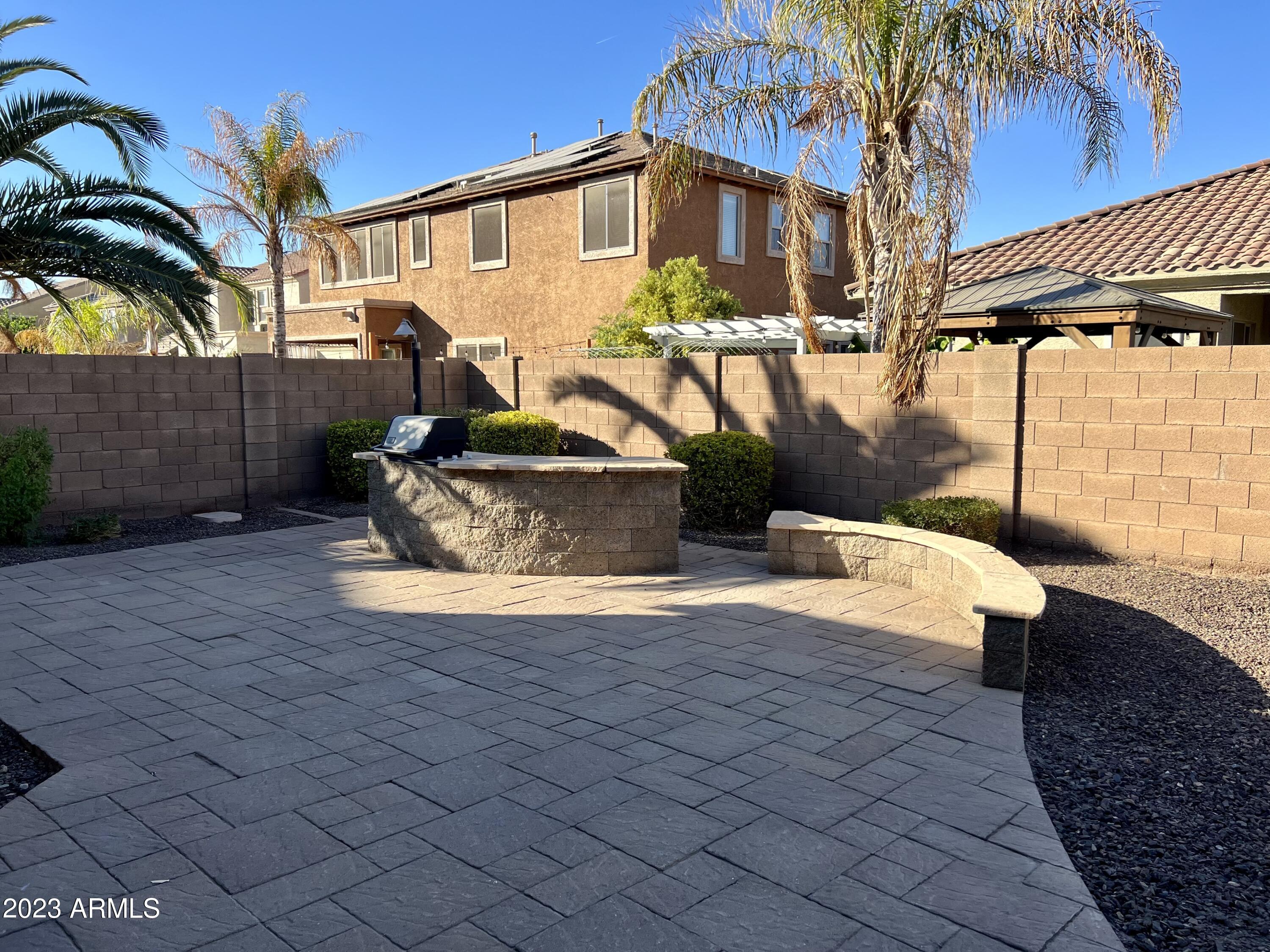 20296 East Sonoqui Boulevard Queen Creek, AZ 85142 - Photo 10 of 22 a view of a house with backyard and swimming pool