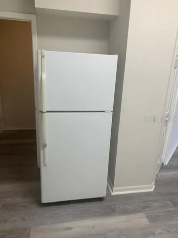 a white refrigerator freezer and a dishwasher