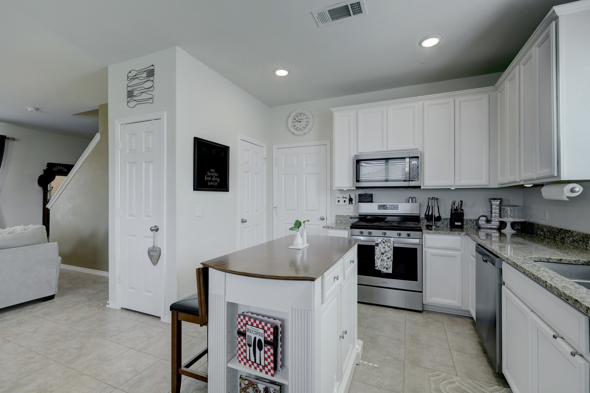 25735 Royal Catchfly Road Katy, TX 77493 - Photo 4 of 31 The stainless steel appliances include a gas range, microwave, and dishwasher.