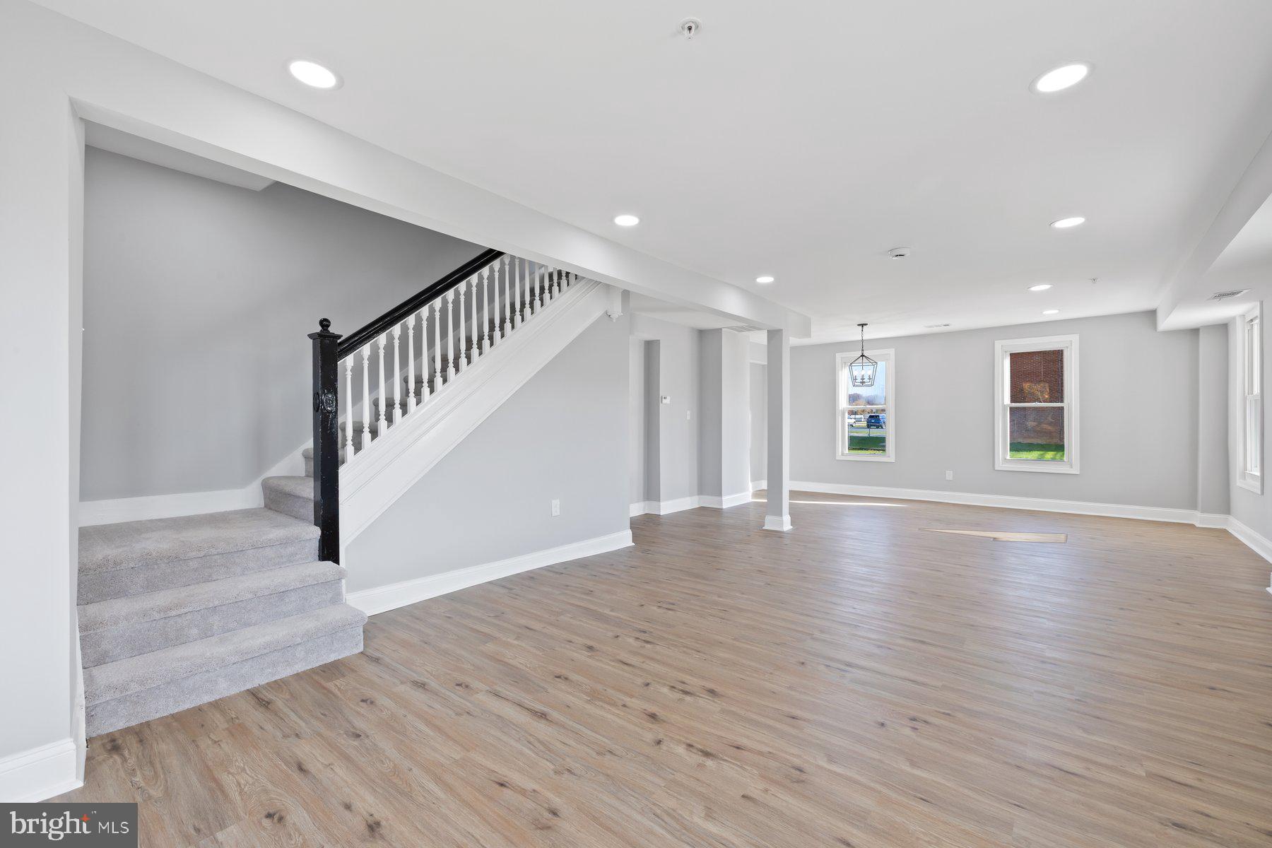 1809 Hanover Pike Hampstead, MD 21074 - Photo 3 of 53 a view of an empty room with wooden floor and stairs