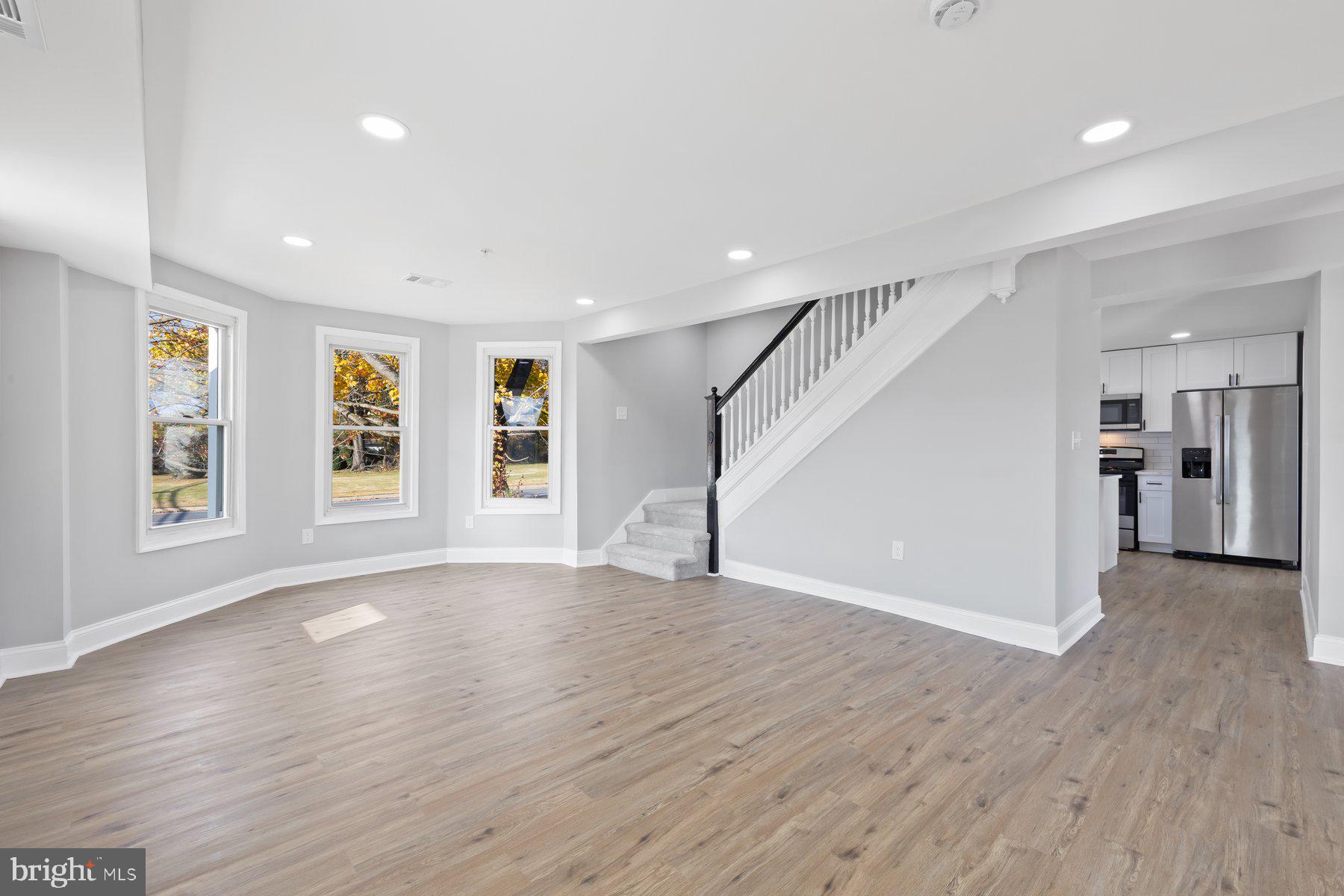 1809 Hanover Pike Hampstead, MD 21074 - Photo 4 of 53 a view of an empty room with wooden floor and windows