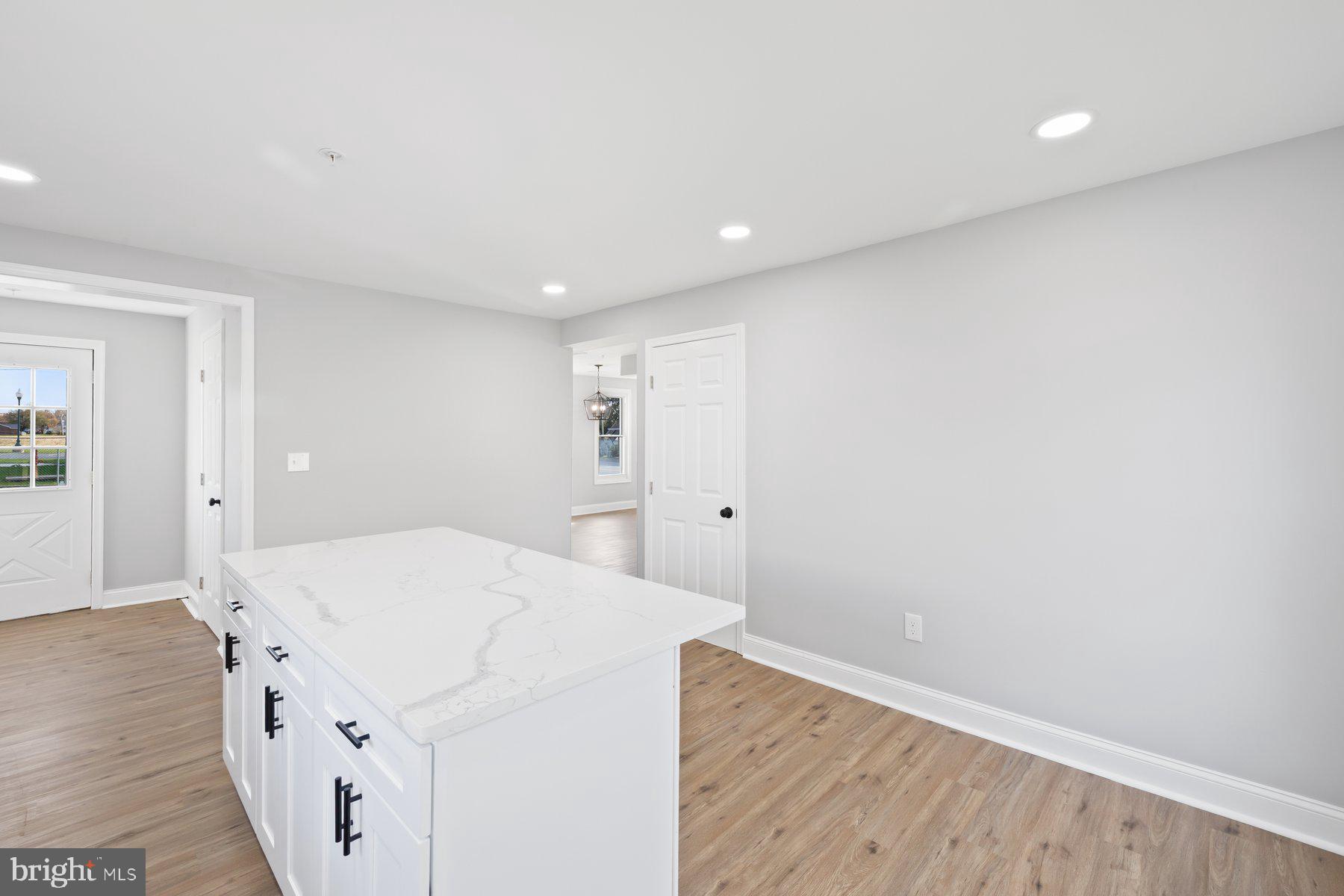 1809 Hanover Pike Hampstead, MD 21074 - Photo 7 of 53 a kitchen with a sink and wooden floor
