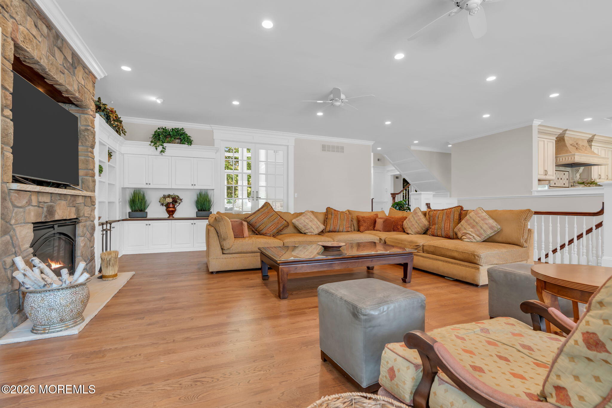 672 Winding River Road Brick, NJ 08724 - Photo 21 of 111 a living room with fireplace furniture and a flat screen tv