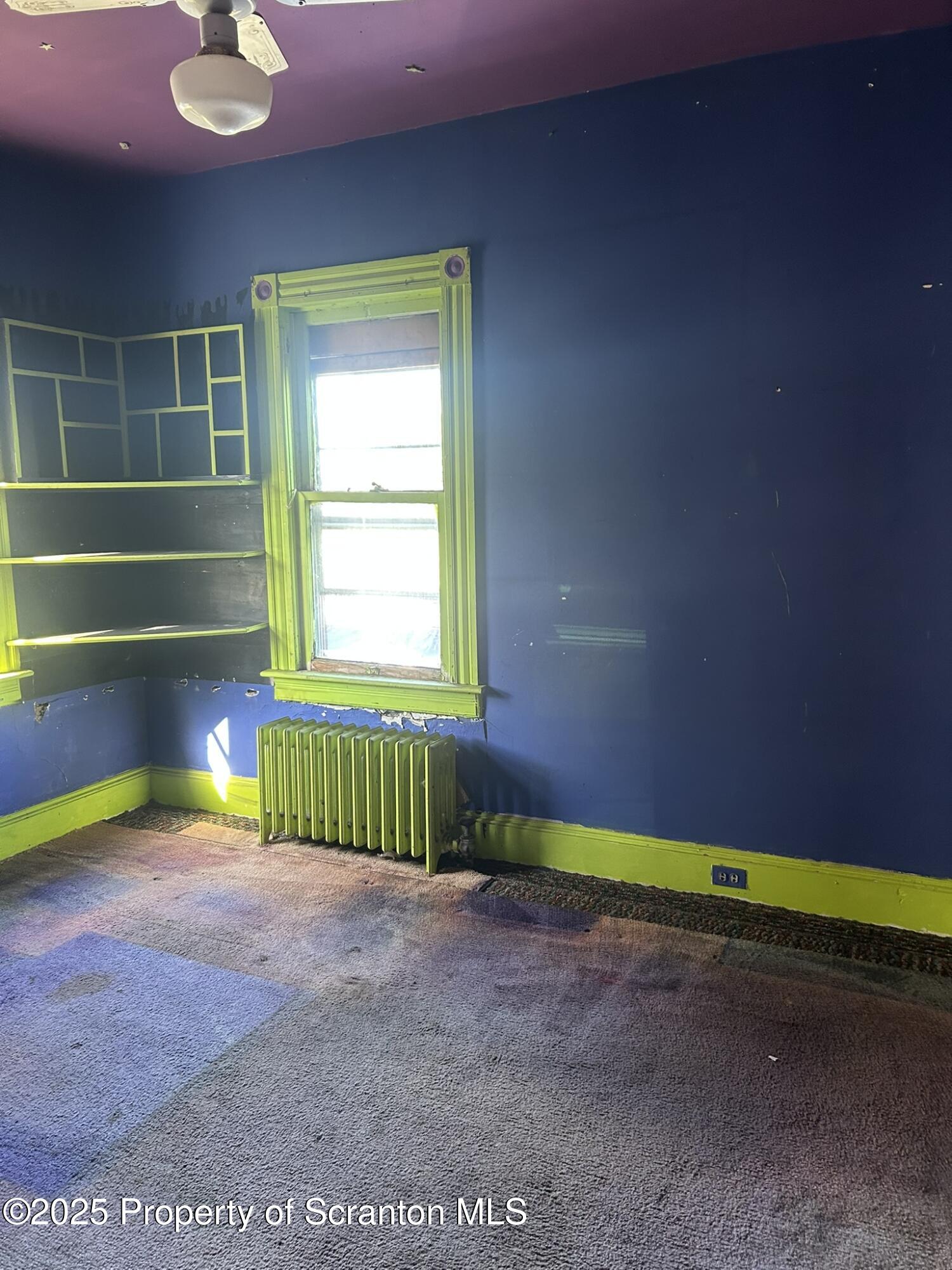 626 Cherry Street Scranton, PA 18505 - Photo 14 of 20 a view of an empty room with a window