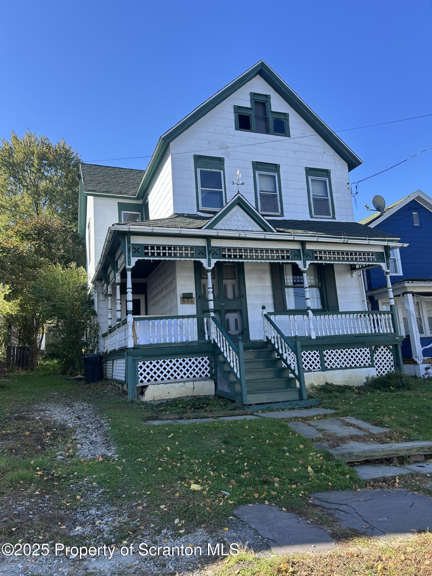 626 Cherry Street Scranton, PA 18505 - Photo 2 of 20 a front view of a house with a yard