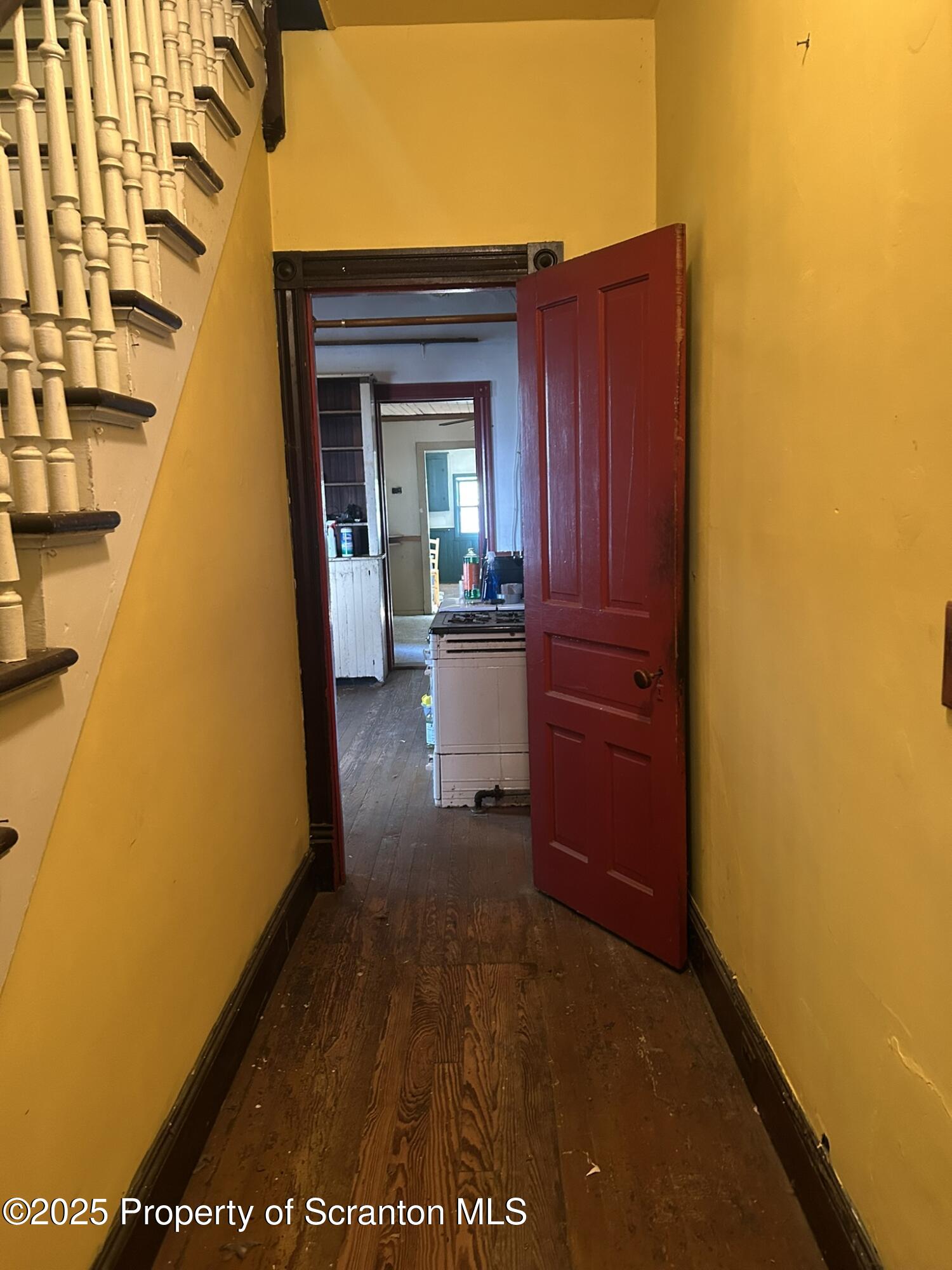 626 Cherry Street Scranton, PA 18505 - Photo 4 of 20 a view of a back door of the house with a yard