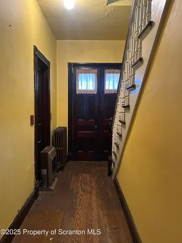a view of entryway with a front door