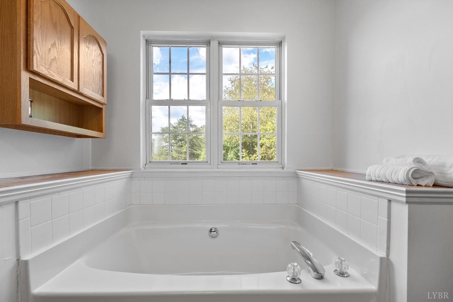 1324 Remington Ridge Drive Goode, VA 24556 - Photo 27 of 49 a white bath tub sitting next to a window