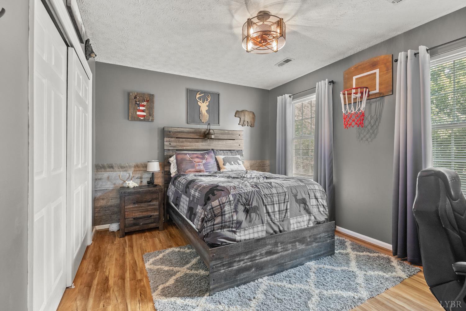 1324 Remington Ridge Drive Goode, VA 24556 - Photo 28 of 49 a bed sitting in a bedroom next to a window