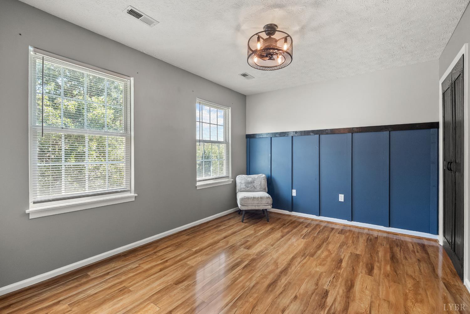 1324 Remington Ridge Drive Goode, VA 24556 - Photo 30 of 49 a view of an empty room with a window and wooden floor