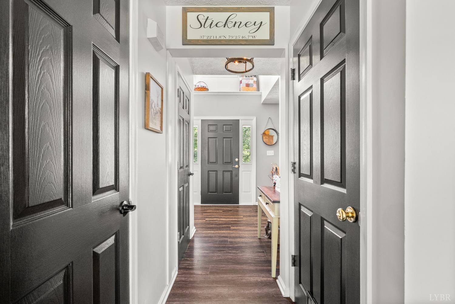 1324 Remington Ridge Drive Goode, VA 24556 - Photo 4 of 49 a view of a hallway with wooden floor