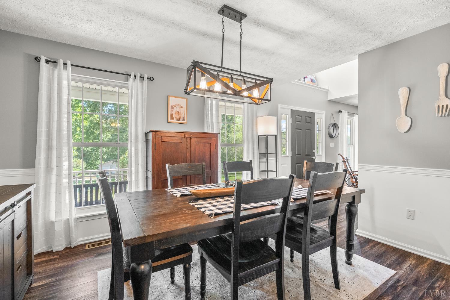 1324 Remington Ridge Drive Goode, VA 24556 - Photo 7 of 49 a view of a dining room with furniture window and wooden floor