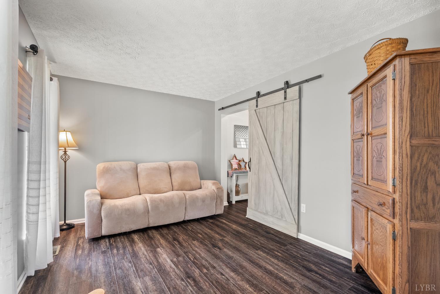 1324 Remington Ridge Drive Goode, VA 24556 - Photo 8 of 49 a living room with furniture and a wooden floor