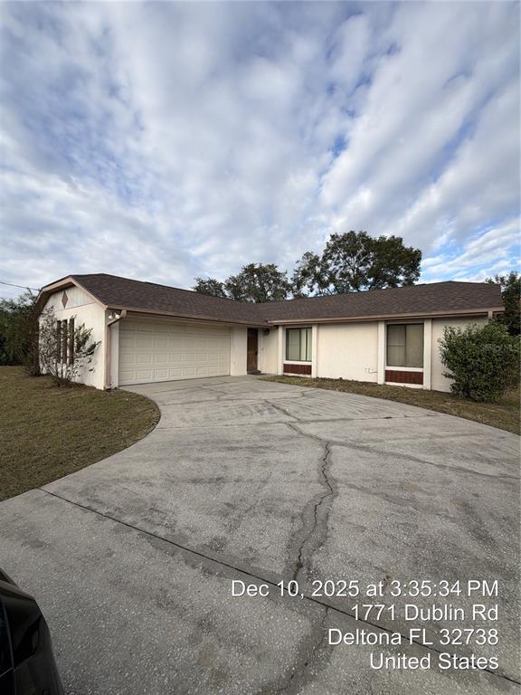 1771 Dublin Road Deltona, FL 32738 - Photo 12 of 17 a view of a house with a yard