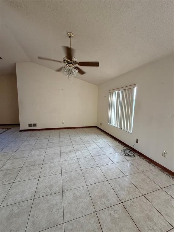 1771 Dublin Road Deltona, FL 32738 - Photo 17 of 17 a view of a livingroom with a staircase