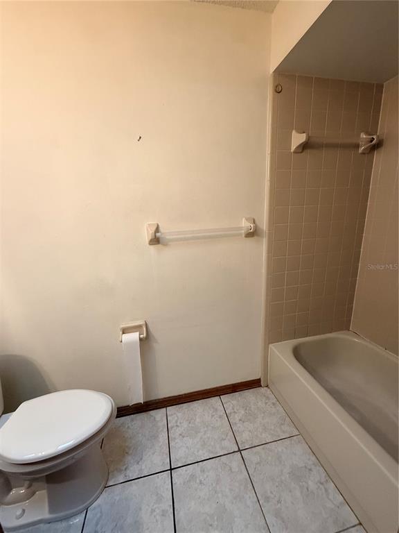 1771 Dublin Road Deltona, FL 32738 - Photo 4 of 17 a bathroom with a toilet and a shower