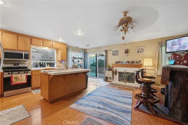 a kitchen with stainless steel appliances granite countertop a stove and a refrigerator