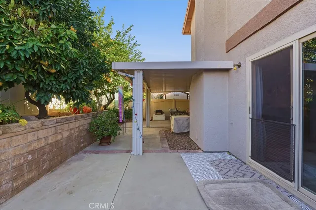a view of a front door and a yard