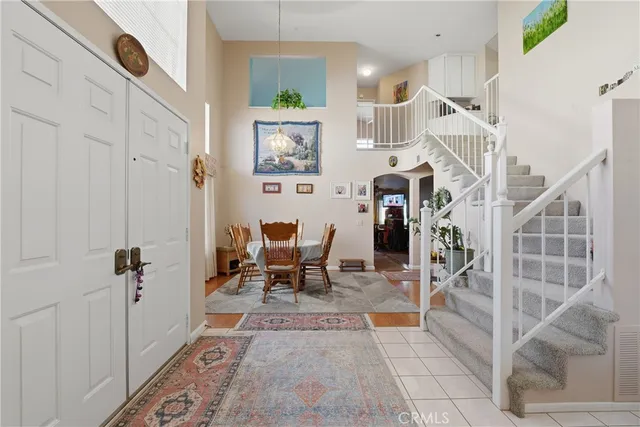a view of hall way with furniture and cabinets
