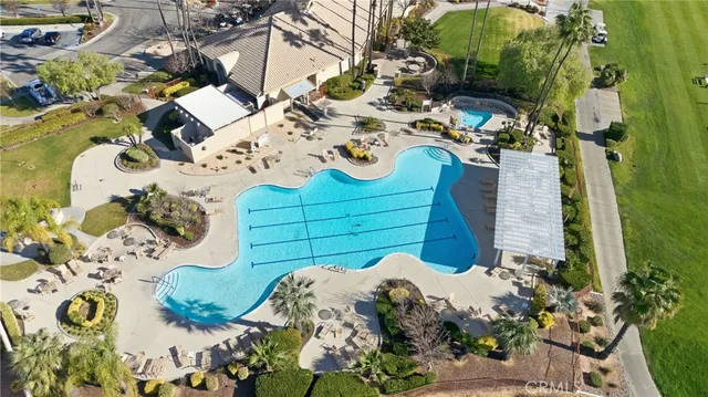 an aerial view of a residential houses with outdoor space