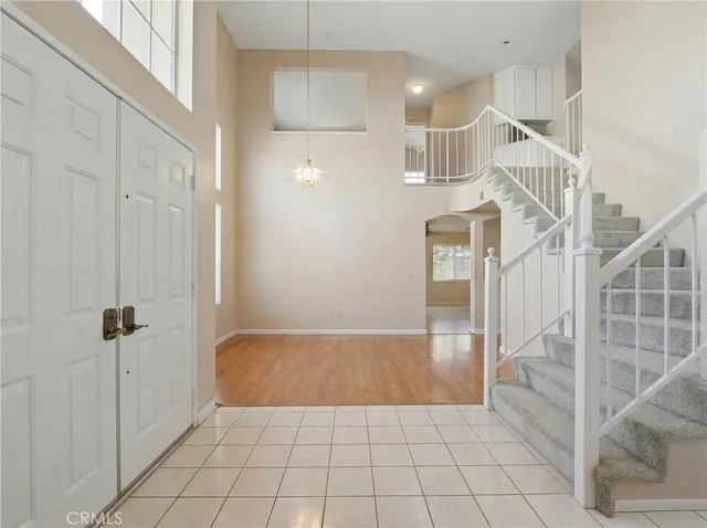 a view of entryway and hall with a rug