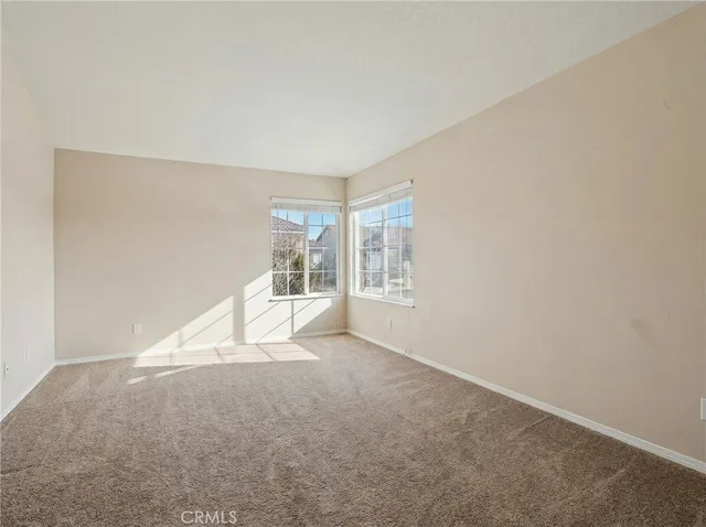 an empty room with a empty space and window