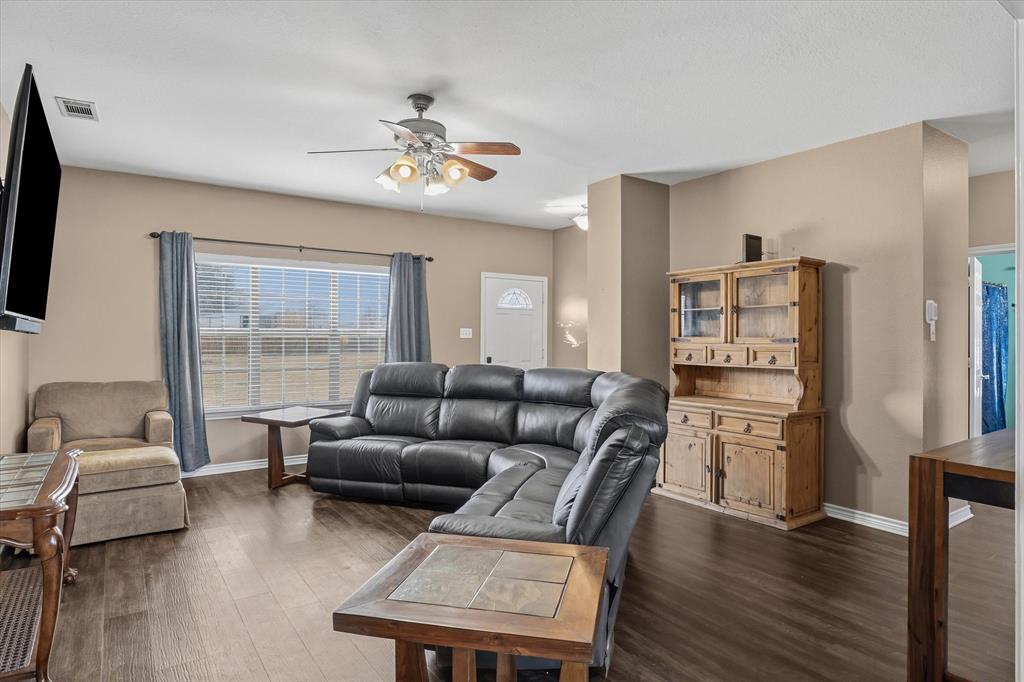 6030 Suncrest Drive Athens, TX 75752 - Photo 13 of 32 a living room with furniture and a flat screen tv