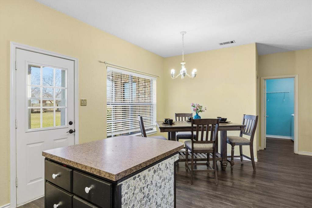 6030 Suncrest Drive Athens, TX 75752 - Photo 18 of 32 a view of a dining room with furniture and wooden floor